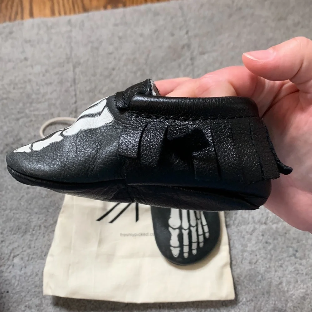 Freshly Picked Black Moccasins with White Skeleton Print